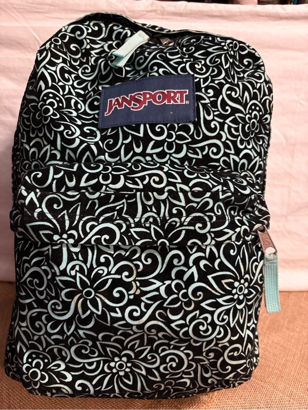 Jansport Black Backpack with Light Blue Floral Print